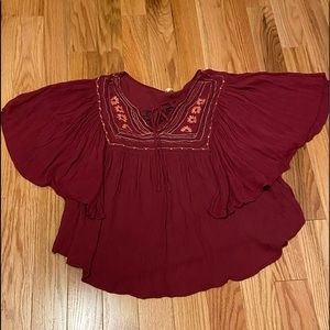Butterfly sleeved boho style pull over top; burgundy/wine